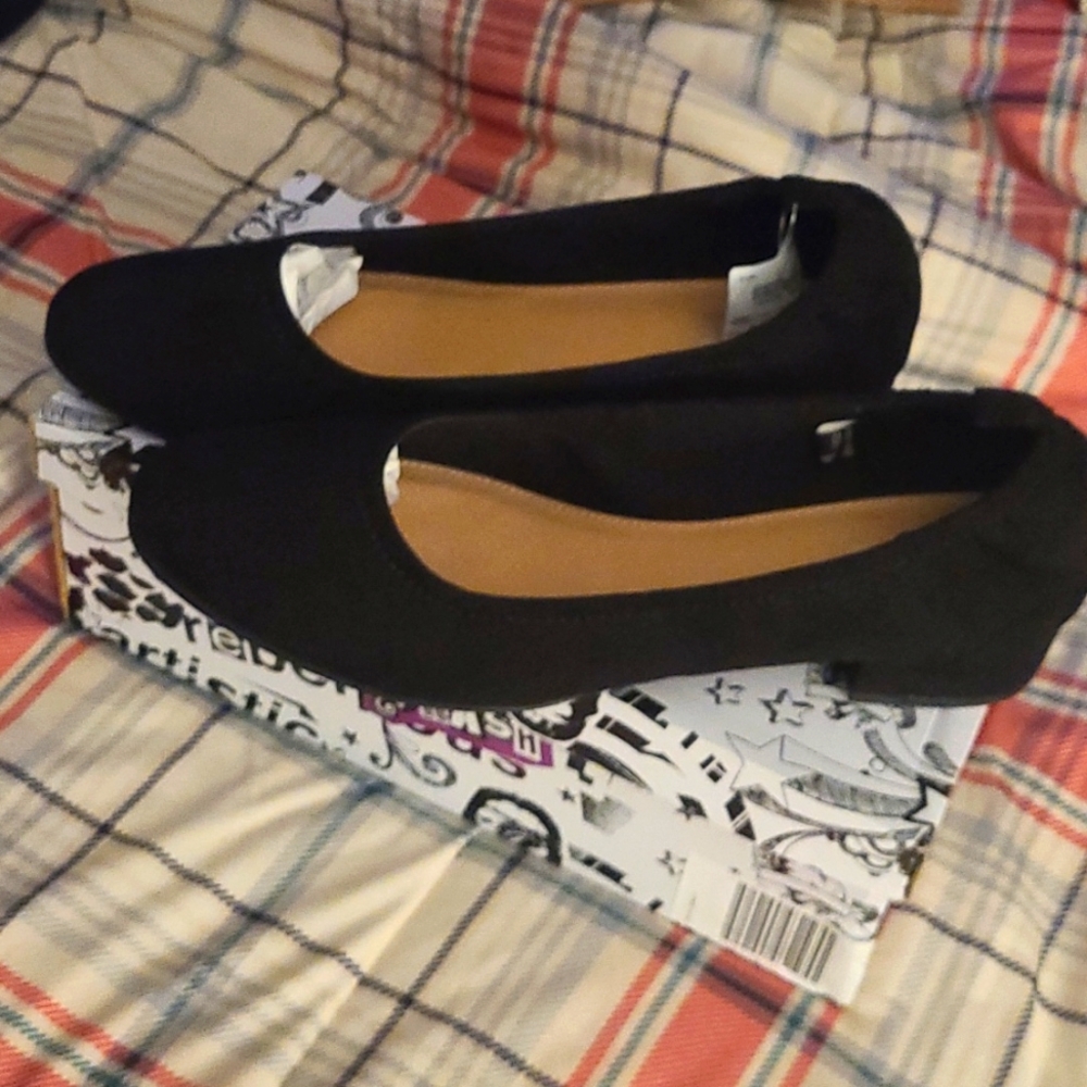 Woman's black flats size 12. Suede feel,  slight heel. Brand new in box